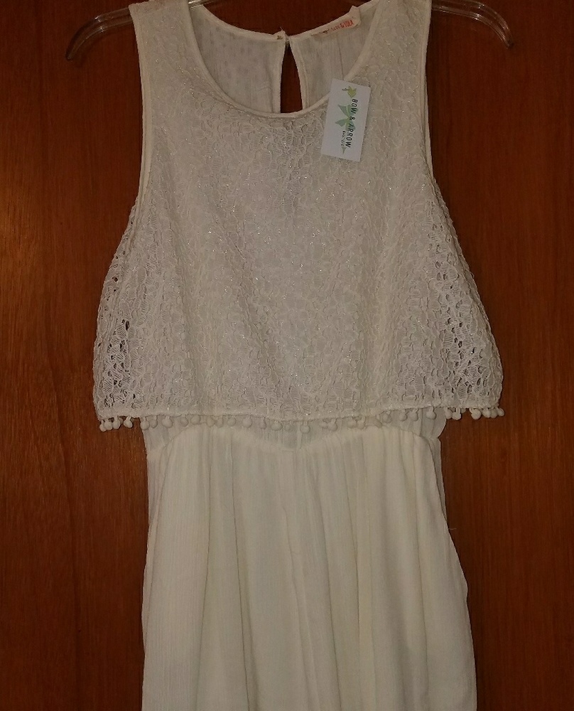 Ivory romper with lace top.